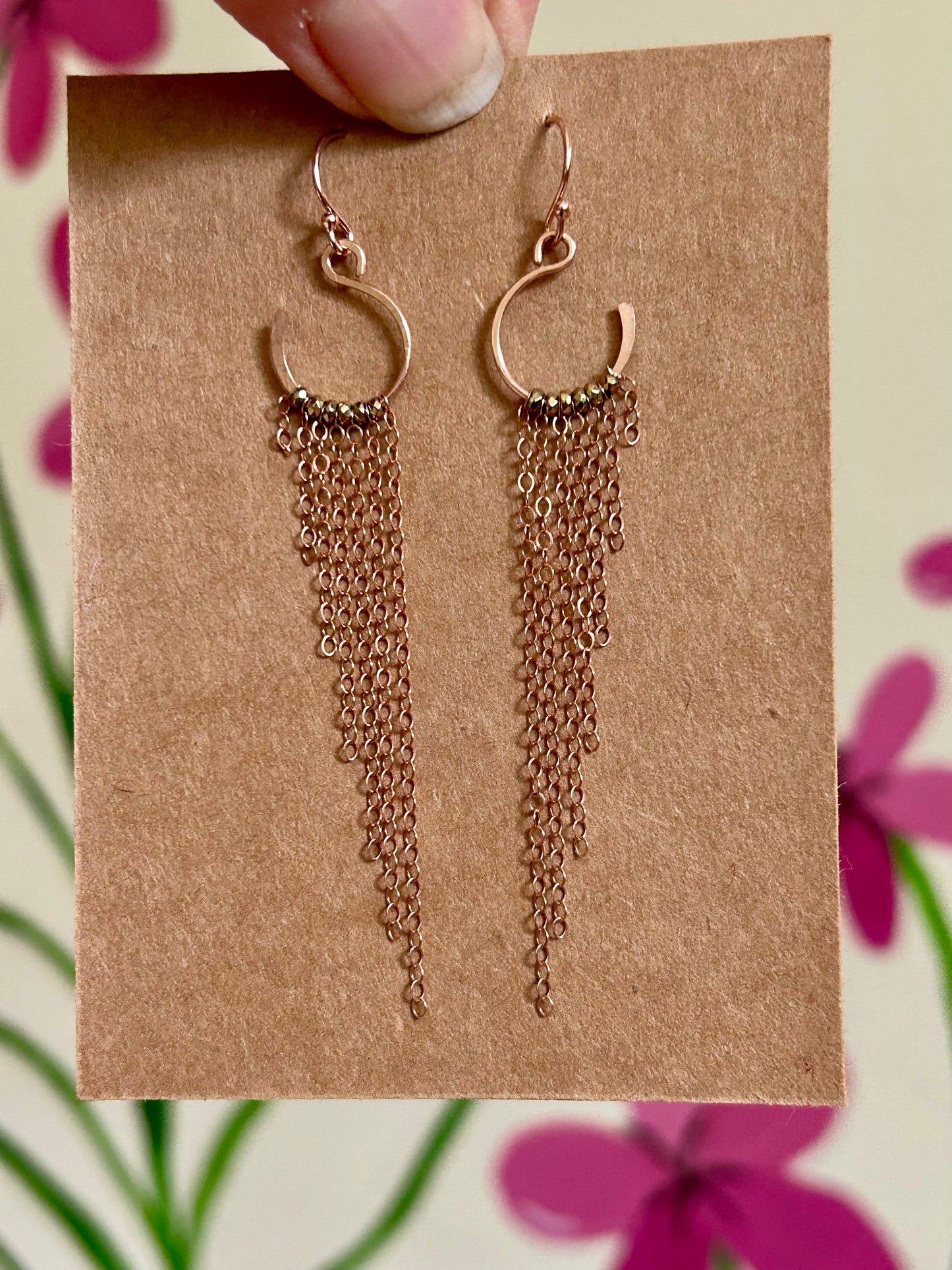 Floating swan earrings in rose gold